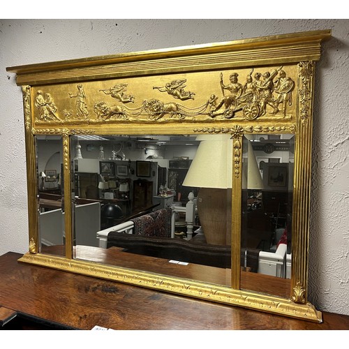 577 - A REGENCY STYLE COMPARTMENTED OVERMANTEL MIRROR the frieze moulded in relief with lion drawn chariot... 