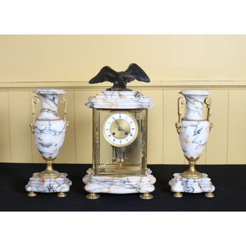 52 - A 19TH CENTURY FRENCH GILT BRASS AND ONYX CLOCK GARNITURE the rectangular glazed case containing an ... 