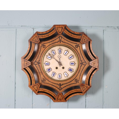 597 - A 19TH CENTURY MAHOGANY WALL CLOCK the circular painted dial with Roman numerals above a shaped case... 