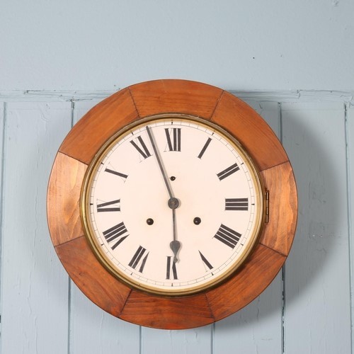 597 - A 19TH CENTURY MAHOGANY WALL CLOCK the circular painted dial with Roman numerals above a shaped case... 