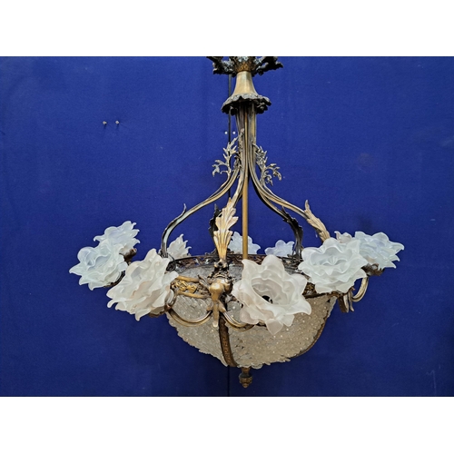 526 - A CONTINENTAL GILT BRASS AND CUT GLASS TEN BRANCH DISH SHAPED CENTRE LIGHT with frost glass petal sh... 