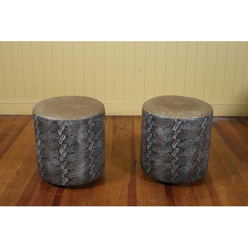 100 - A PAIR OF FAUX CROCODILE UPHOLSTERED FOOTSTOOLS each of cylindrical form 46cm (h) x 42cm (d)