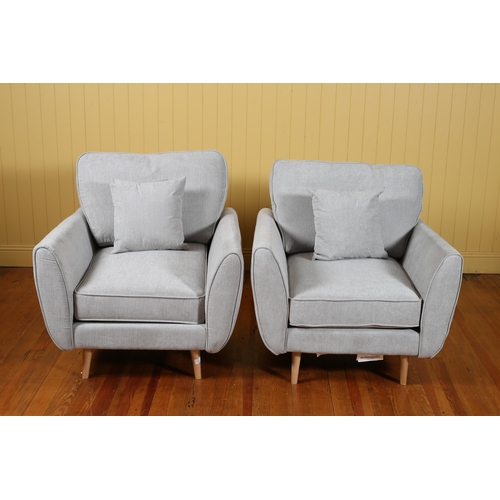 102 - A PAIR OF DESIGNER CHAIRS of rectangular outline with shaped arms and loose cushions on cylindrical ... 