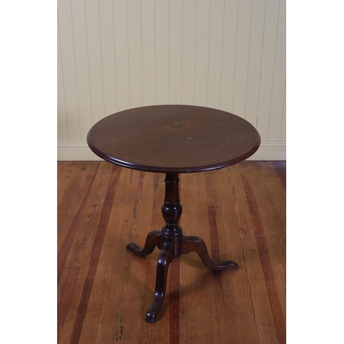 105 - A GEORGIAN STYLE MAHOGANY OCCASIONAL TABLE the circular moulded top with satinwood string inlay abov... 