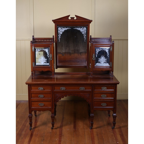 12 - AN EDWARDIAN MAHOGANY DRESSING TABLE bears plaque 'Pimm Brothers Dublin' the superstructure with bev... 