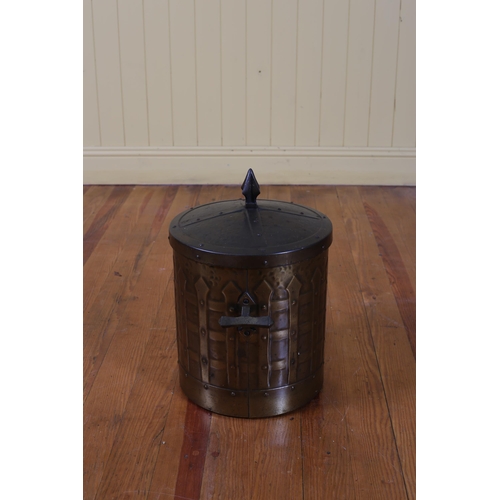 129 - A VINTAGE OXYDISED LIDDED FUEL BIN of cylindrical form with zinc liner 45cm (h)