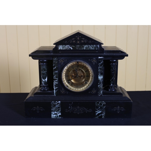 133 - A BLACK AND GREEN VEINED MARBLE MANTEL CLOCK of architectural outline the brass dial with Roman nume... 