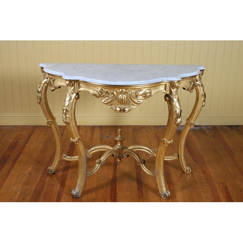 180 - A 19TH CENTURY CARVED GILTWOOD AND MARBLE CONSOLE TABLE of demi lune outline surmounted by a white v... 