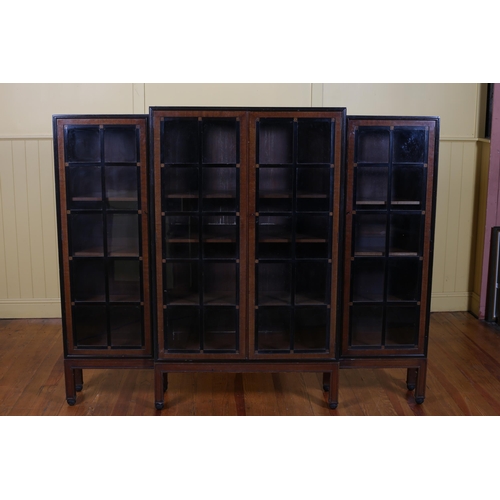 189 - A VINTAGE MAHOGANY EBONISED INLAID FOUR DOOR BREAKFRONT DISPLAY CABINET with adjustable shelves on p... 