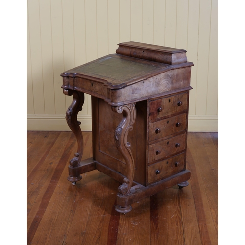 19 - A 19TH CENTURY WALNUT DAVENPORT the superstructure with hinged compartment above a tooled leather wr... 