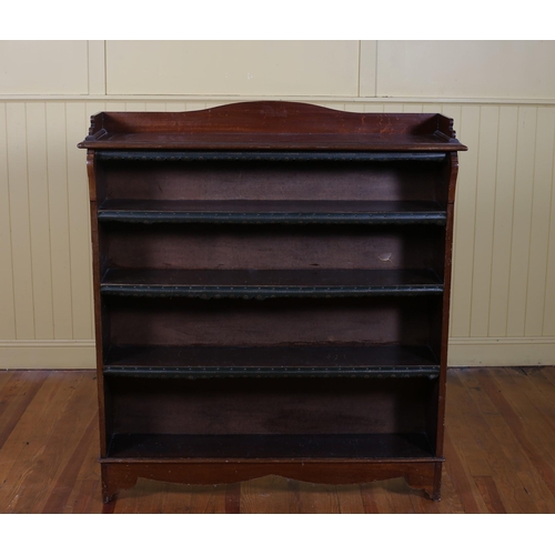 198 - A VINTAGE MAHOGANY FOUR TIER OPENFRONT BOOKSHELF the moulded three quarter gallery above open shelve... 