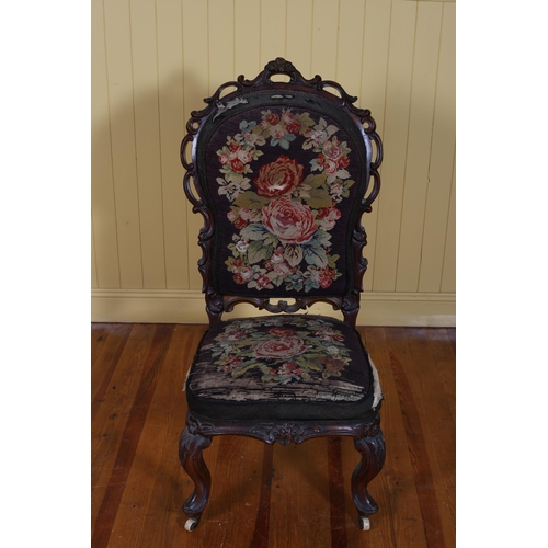 200 - A VICTORIAN CARVED MAHOGANY AND NEEDLEWORK UPHOLSTERED SIDE CHAIR the pierced C-scroll carved frame ... 