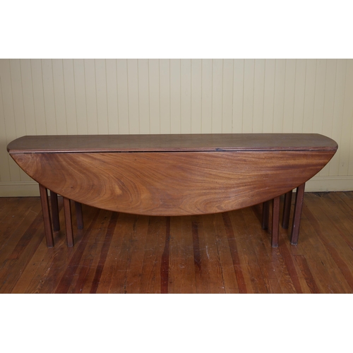 245 - A GEORGIAN STYLE MAHOGANY HUNT TABLE the rectangular oval hinged top on square moulded legs 72cm (h)... 