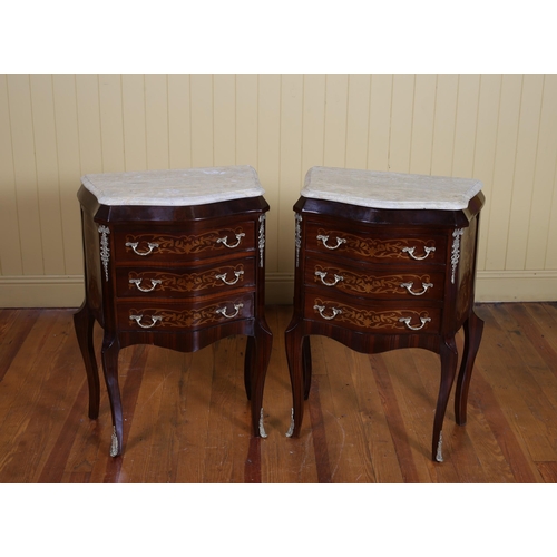 25 - A PAIR OF CONTINENTAL KINGWOOD MARQUETRY AND GILT BRASS MOUNTED CHESTS each of bombe outline surmoun... 