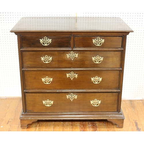 3 - A GEORGIAN OAK CHEST of two short and three long graduated drawers with pierced back plates and bras... 