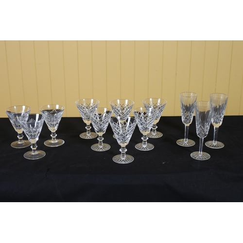 317 - A SET OF SIX WATERFORD CUT GLASS WINE GLASSES, three Waterford cut glass champagne flutes, a set of ... 