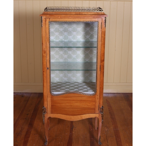 345 - A CONTINENTAL SATINWOOD AND GILT BRASS MOUNTED CHINA DISPLAY CABINET the shaped top with pierced bra... 