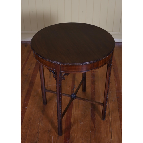 360 - A HEPPLEWHITE STYLE MAHOGANY OCCASIONAL TABLE the circular top above a moulded apron on square carve... 