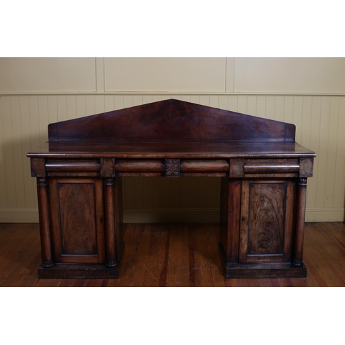 363 - A 19TH CENTURY MAHOGANY PEDESTAL SIDEBOARD the rectangular arched back above three frieze drawers an... 