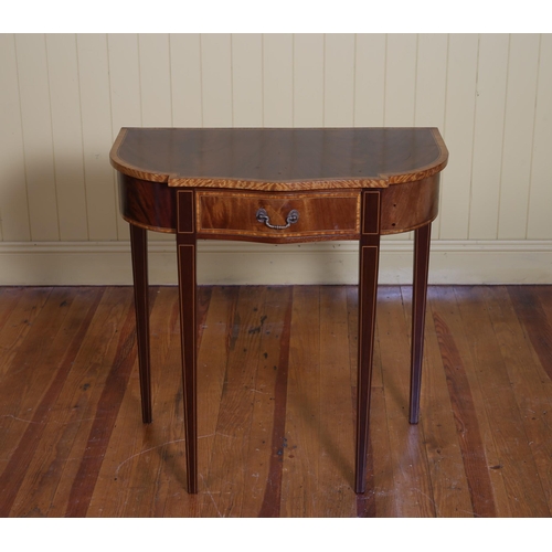 364 - A SHERATON DESIGN MAHOGANY AND SATINWOOD CROSSBANDED SIDE TABLE of serpentine outline the shaped top... 