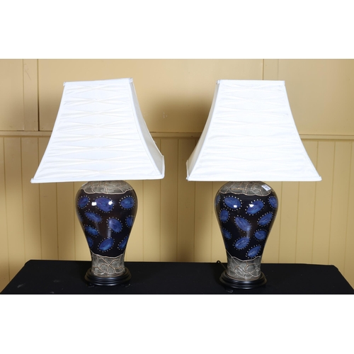 373 - A PAIR OF DOULTON AND LAMBETH STYLE TABLE LAMPS each of baluster form raised on a hardwood stand wit... 