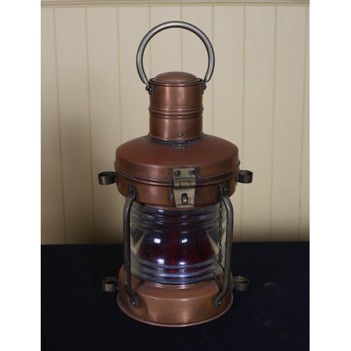 376 - A VINTAGE COPPER MARINER'S LANTERN electrified with brass swing handle with glazed panel on platform... 