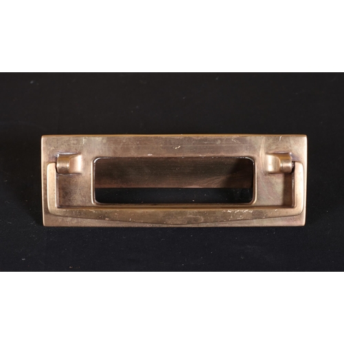 388 - A VINTAGE BRASS DOOR FLAP AND KNOCKER