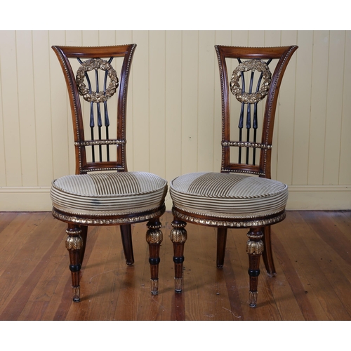 394 - A PAIR OF FRENCH MAHOGANY AND PARCEL GILT OCCASIONAL CHAIRS each with a curved top rail with laurel ... 