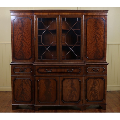 58 - A GEORGIAN STYLE MAHOGANY FOUR DOOR SECRETAIRE LIBRARY BOOKCASE the moulded cornice above a pair of ... 