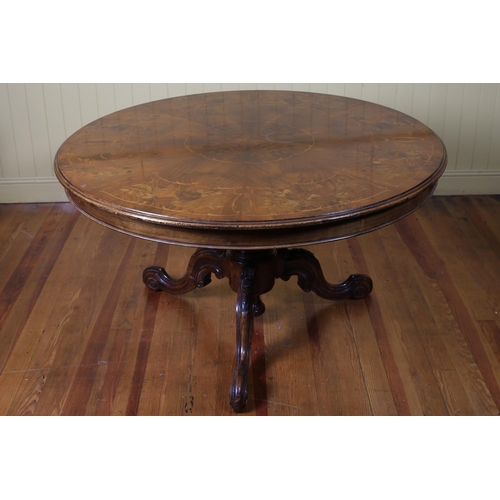 7 - A 19TH CENTURY WALNUT AND MARQUETRY POD TABLE the circular inlaid top above a  carved column on trip... 