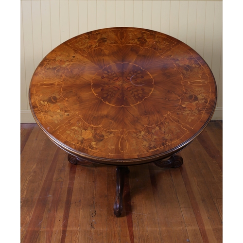 7 - A 19TH CENTURY WALNUT AND MARQUETRY POD TABLE the circular inlaid top above a  carved column on trip... 