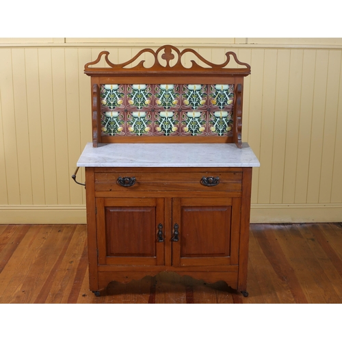 71 - A VINTAGE SATIN BIRCH WASHSTAND the tiled splashback above a white veined marble top with frieze dra... 