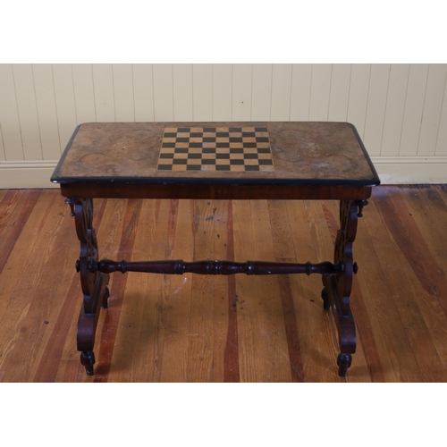 74 - A 19TH CENTURY BURR WALNUT AND MARQUETRY GAMES TABLE of rectangular outline the shaped top centred b... 