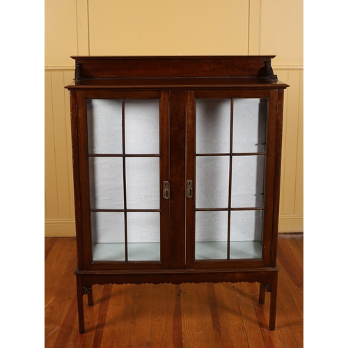 76 - A VINTAGE MAHOGANY DISPLAY CABINET with astragal glazed doors containing shelves on square moulded l... 