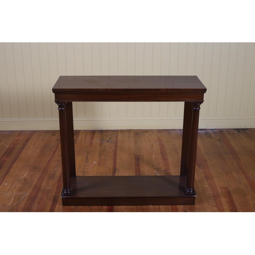 80 - AN EMPIRE STYLE MAHOGANY CONSOLE TABLE the rectangular moulded top raised on cylindrical ring turned... 