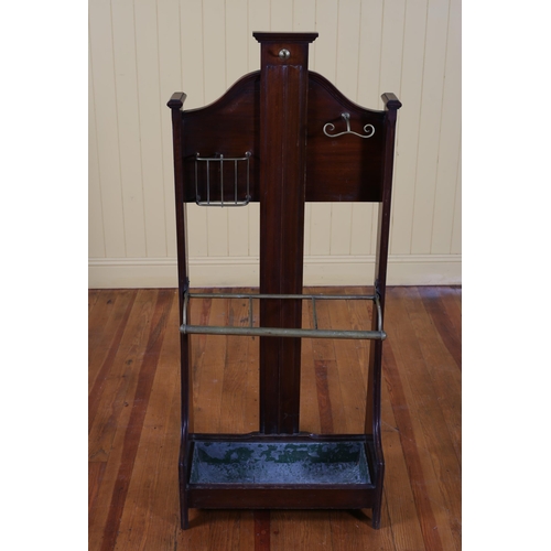 87 - A VINTAGE MAHOGANY AND BRASS STICK STAND in the manner of James Shoolbred the shaped back with brass... 