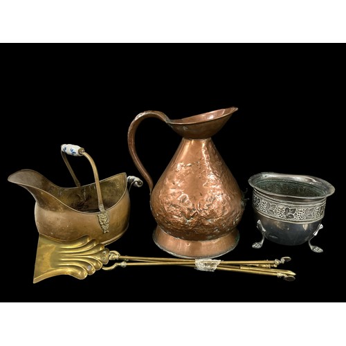 507 - A BRASS DUTCH SWING HANDLE COAL HELMET, a large copper measure (AF), a set of three brass fire irons... 