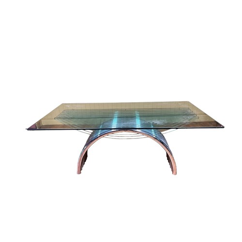 503 - A CHROME AND GLASS TABLE circa 1970s attributed to Renato Zevi the rectangular glass top raised on g... 