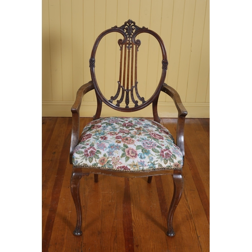 272 - A HEPPLEWHITE STYLE MAHOGANY ELBOW CHAIR with pierced vertical splat above an upholstered seat on ca... 