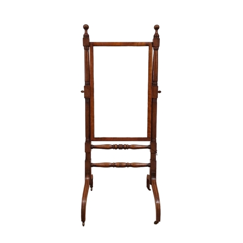 242 - A REGENCY MAHOGANY CHEVAL MIRROR the rectangular plate within a moulded frame raised on ring turned ... 