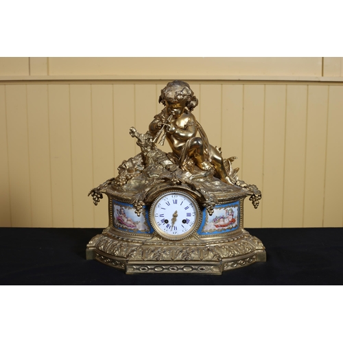 333 - A 19TH CENTURY FRENCH GILT BRASS AND PORCELAIN CLOCK surmounted by a figure shown seated in a rustic... 