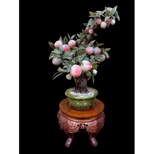 114 - A JADE BONSAI PEACH TREE on a hardwood stand 76cm (h)