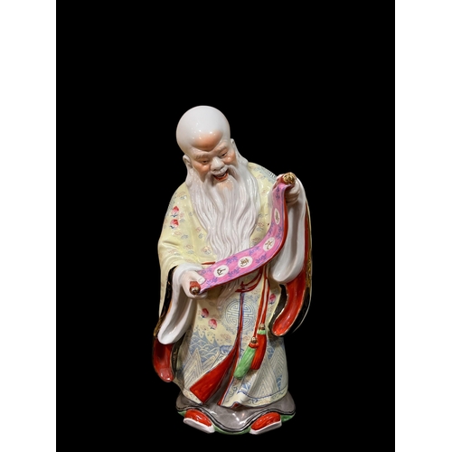 115 - A FAMILLE ROSE CHINA FIGURE modelled as an Ancestor Scholar 46cm (h)