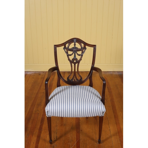 12 - A 19TH CENTURY MAHOGANY HEPPLEWHITE DESIGN MAHOGANY DINING CHAIR the shaped top rail above a pierced... 