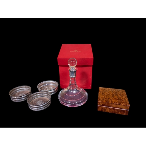 128 - A STERLING SILVER AND CRYSTAL SHIP'S DECANTER, three plated on copper wine coasters, a burr walnut c... 