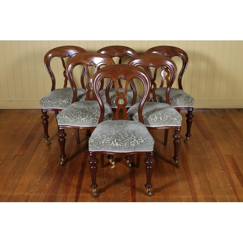 14 - A SET OF SIX VICTORIAN MAHOGANY DINING CHAIRS each with a curved top rail and pierced vertical splat... 