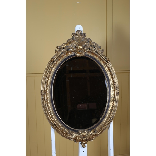 150 - A CONTINENTAL GILT FRAME MIRROR the oval bevelled glass plate within a foliate and beadwork moulded ... 