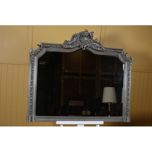 151 - A CONTINENTAL SILVER FRAME MIRROR the rectangular arched bevelled glass plate within an egg and dart... 