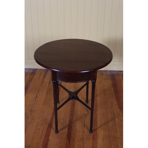 179 - A VINTAGE MAHOGANY OVAL SWIVEL TOP DROP LEAF TABLE the shaped top with frieze drawer on fluted taper... 