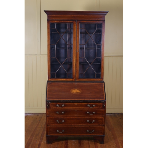 181 - AN EDWARDIAN SHERATON STYLE MAHOGANY AND SATINWOOD INLAID BUREAU BOOKCASE the moulded cornice above ... 